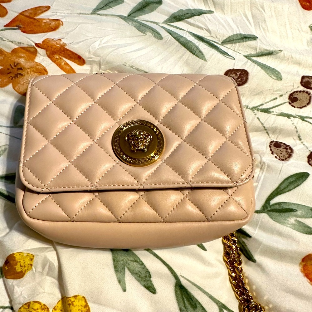 "Functional Luxury: Versace Mini Bag in Soft Pink, Designed to chic style